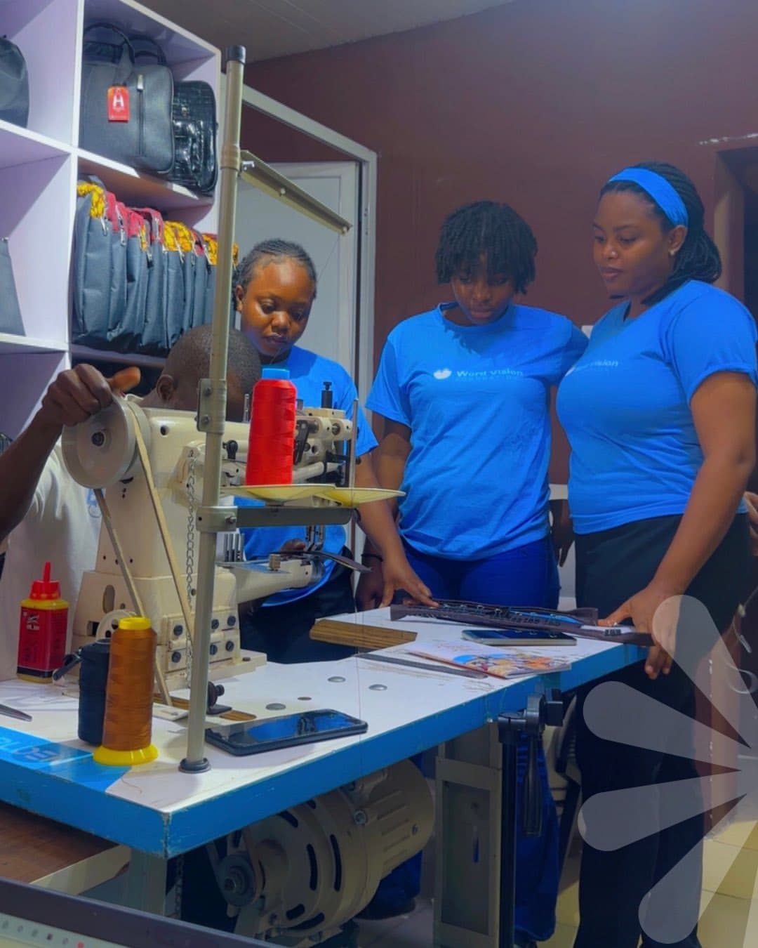 Beneficiaries learning bag-making skills